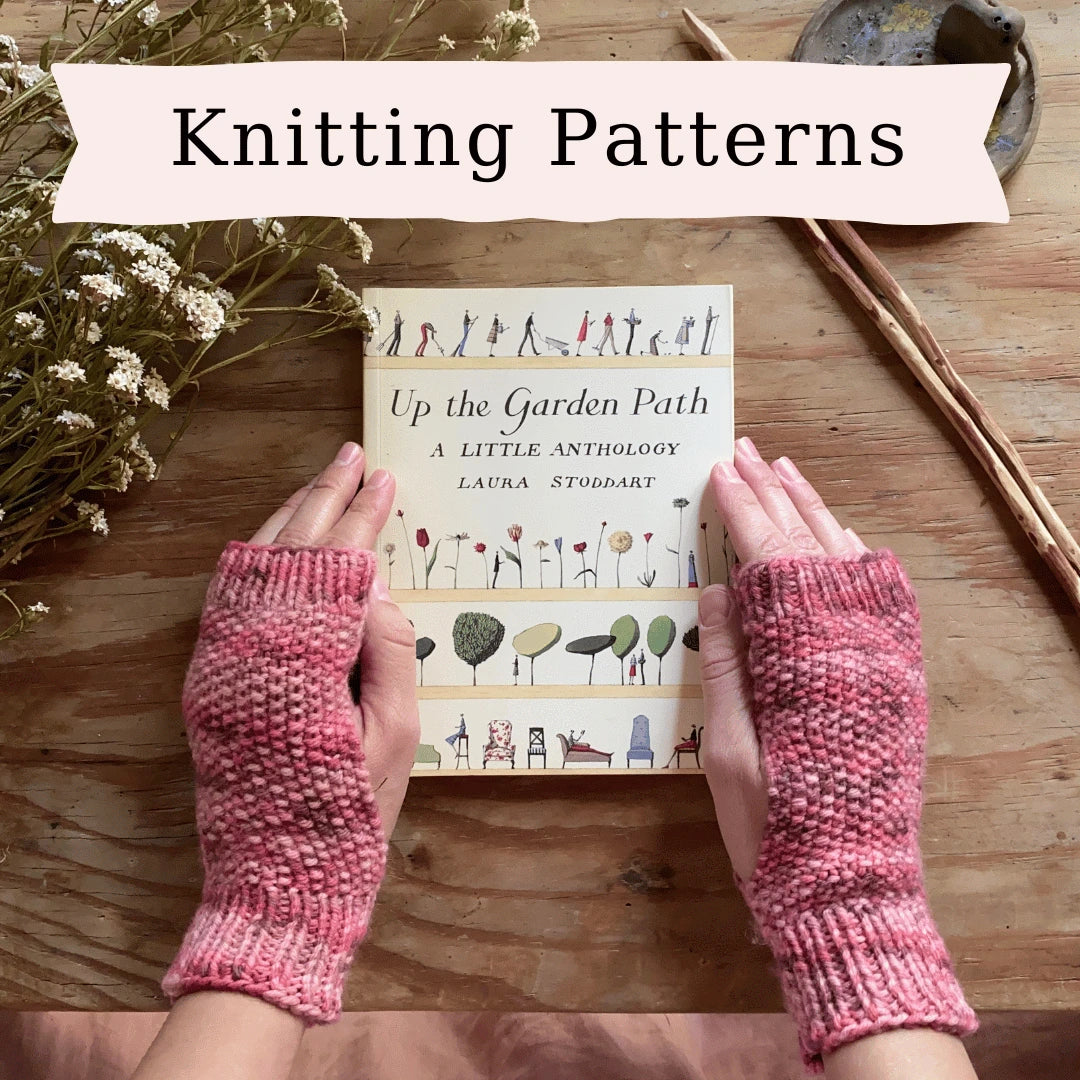 The word Knitting Patterns with two hands wearing knitted fingerless mitts holding a book.