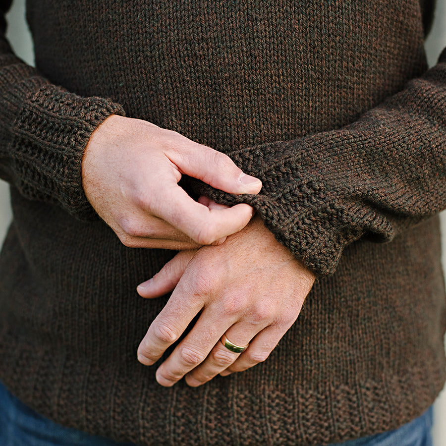 Close up of a mans hands.