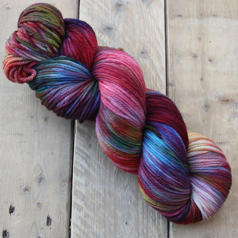 Skein of rainbow coloured DK yarn