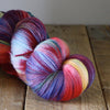 Skein of rainbow coloured fingering yarn
